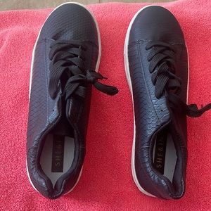 She&In black sneakers with a snakeprint design